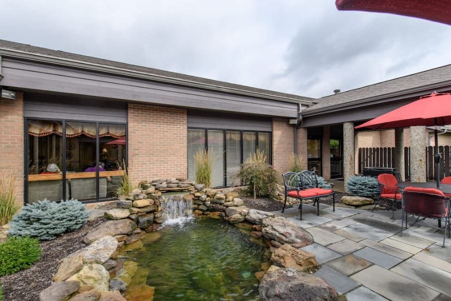 Outdoor space with a fountain and seating area