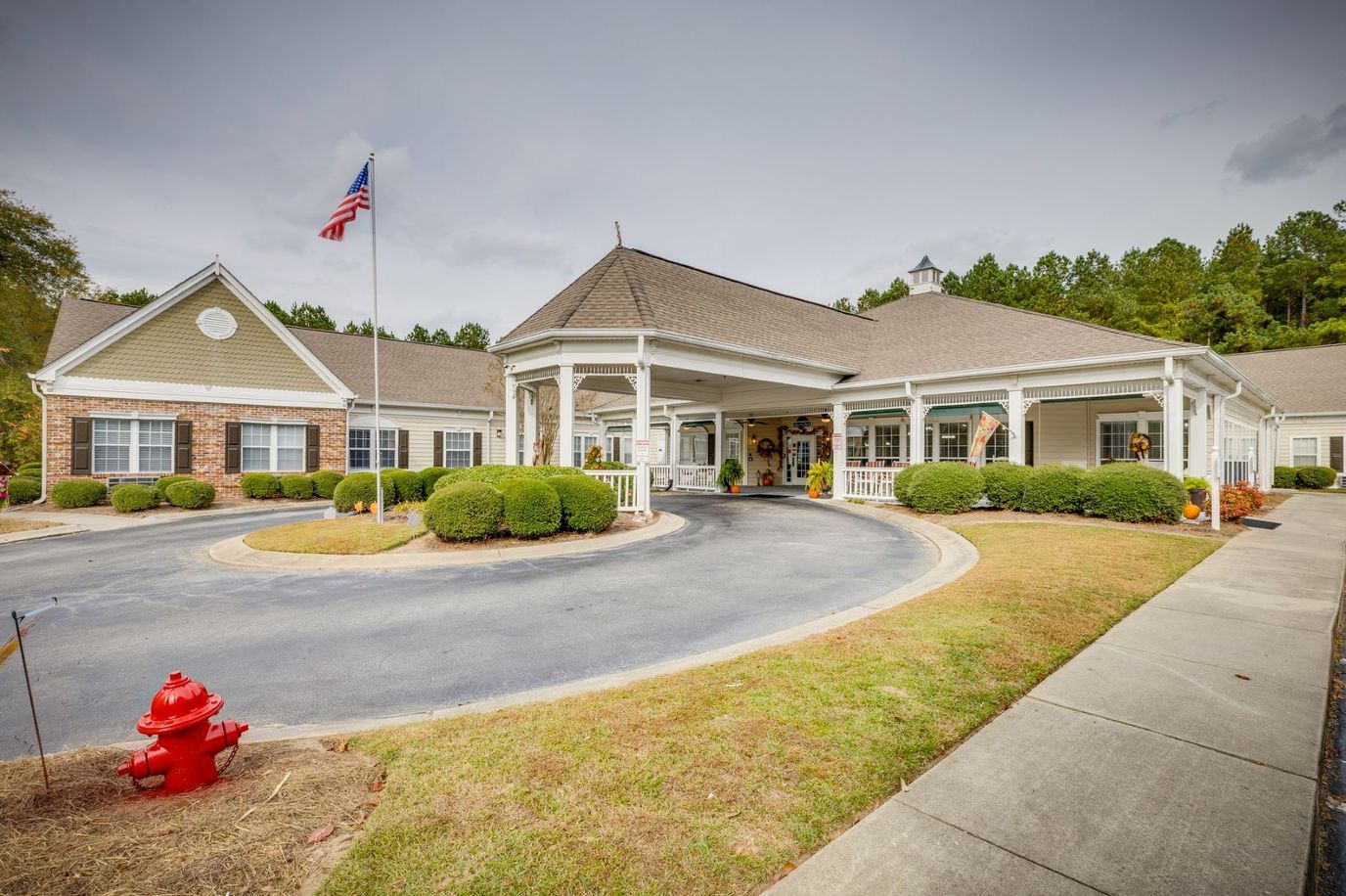 Exterior view of assisted living facility with landscaped entrance