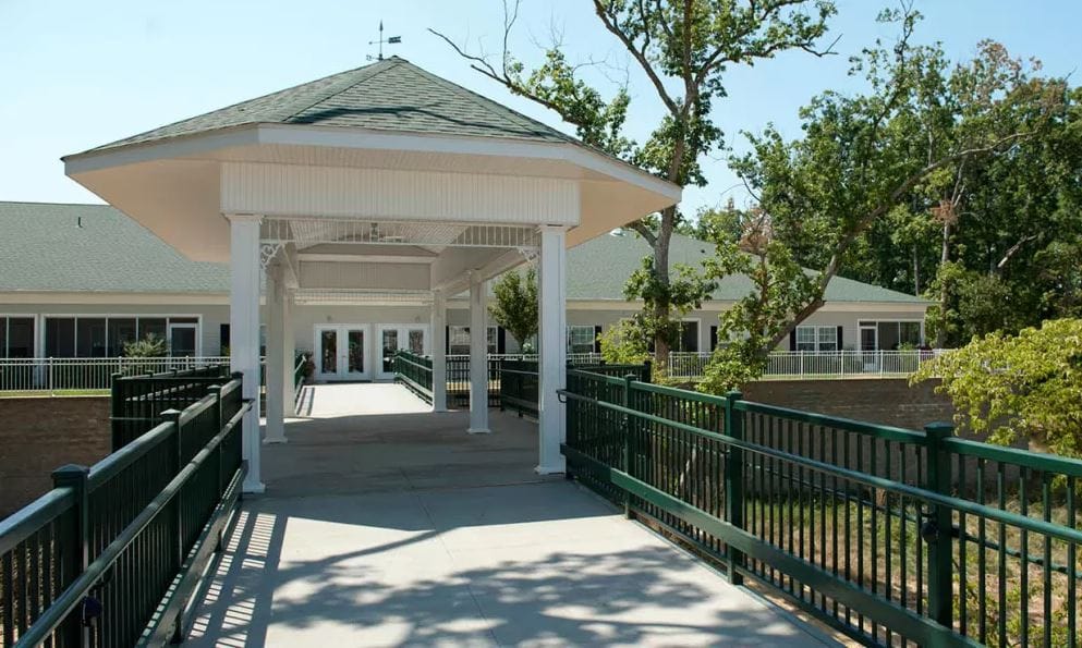 Covered walkway leading to the facility entrance