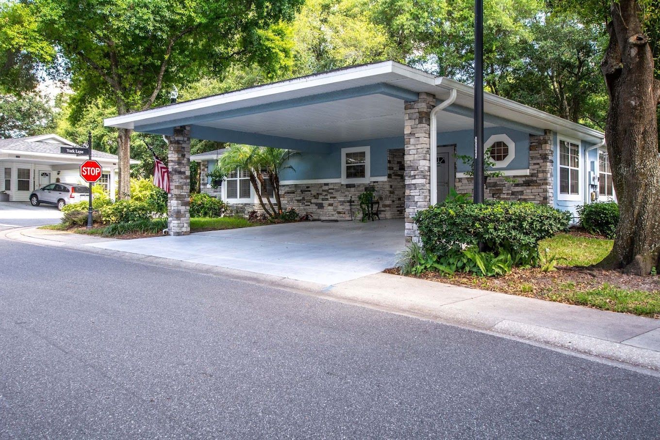 Exterior view of a building entrance with covered parking
