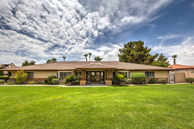 Exterior view of The Quail House with landscaped lawn