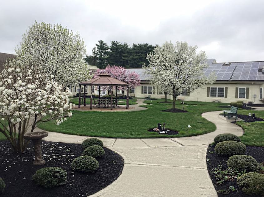 Beautiful landscaped garden with flowering trees and a gazebo