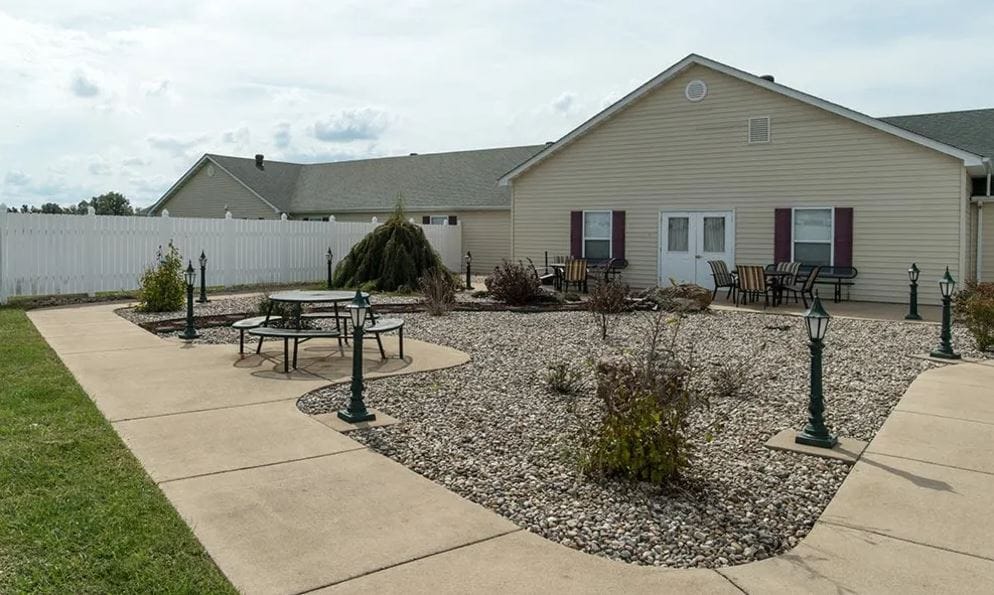 Outdoor seating area with landscaping and pathways