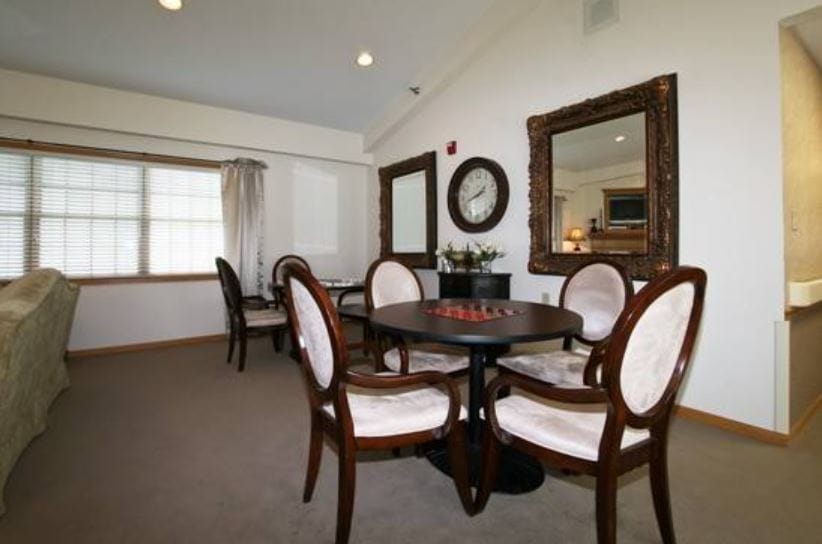 Brightly lit interior apartment space with seating