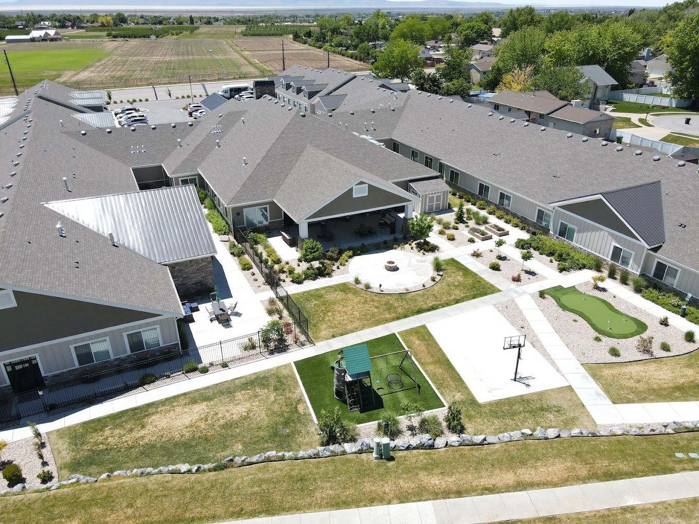 Aerial view of Whisper Cove Assisted Living facility with gardens