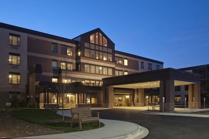 Exterior view of the assisted living facility at dusk