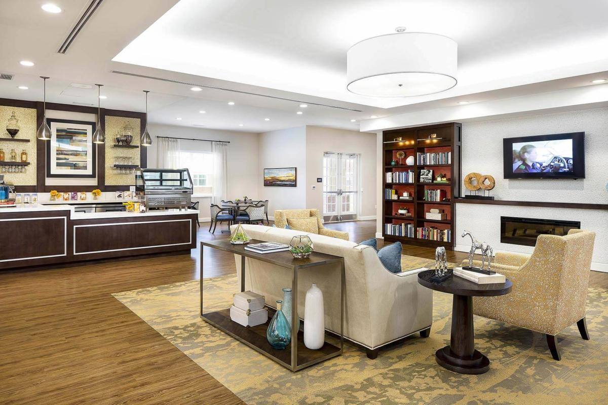 Bright common area with dining space and seating