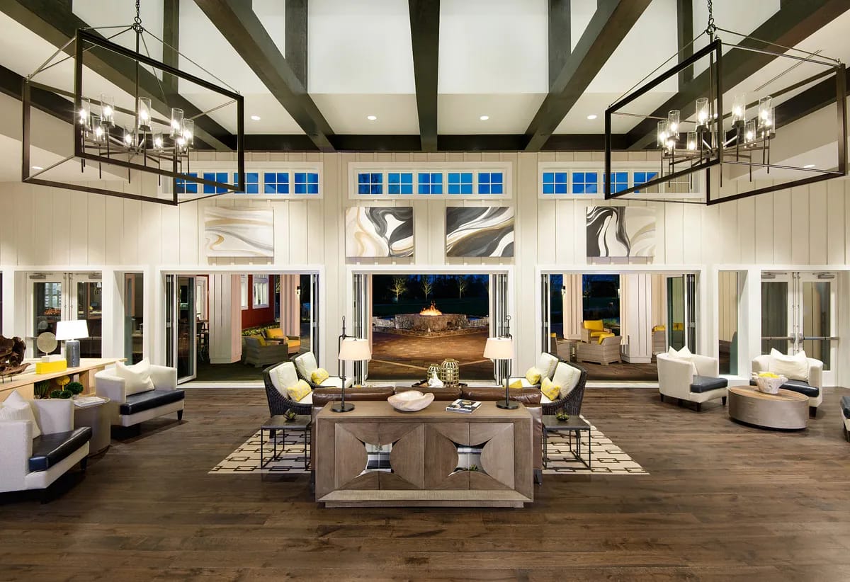Well-furnished interior common area with large windows