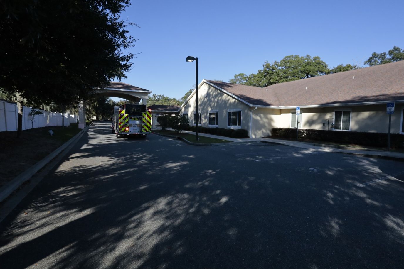Exterior view of the facility entrance with a vehicle