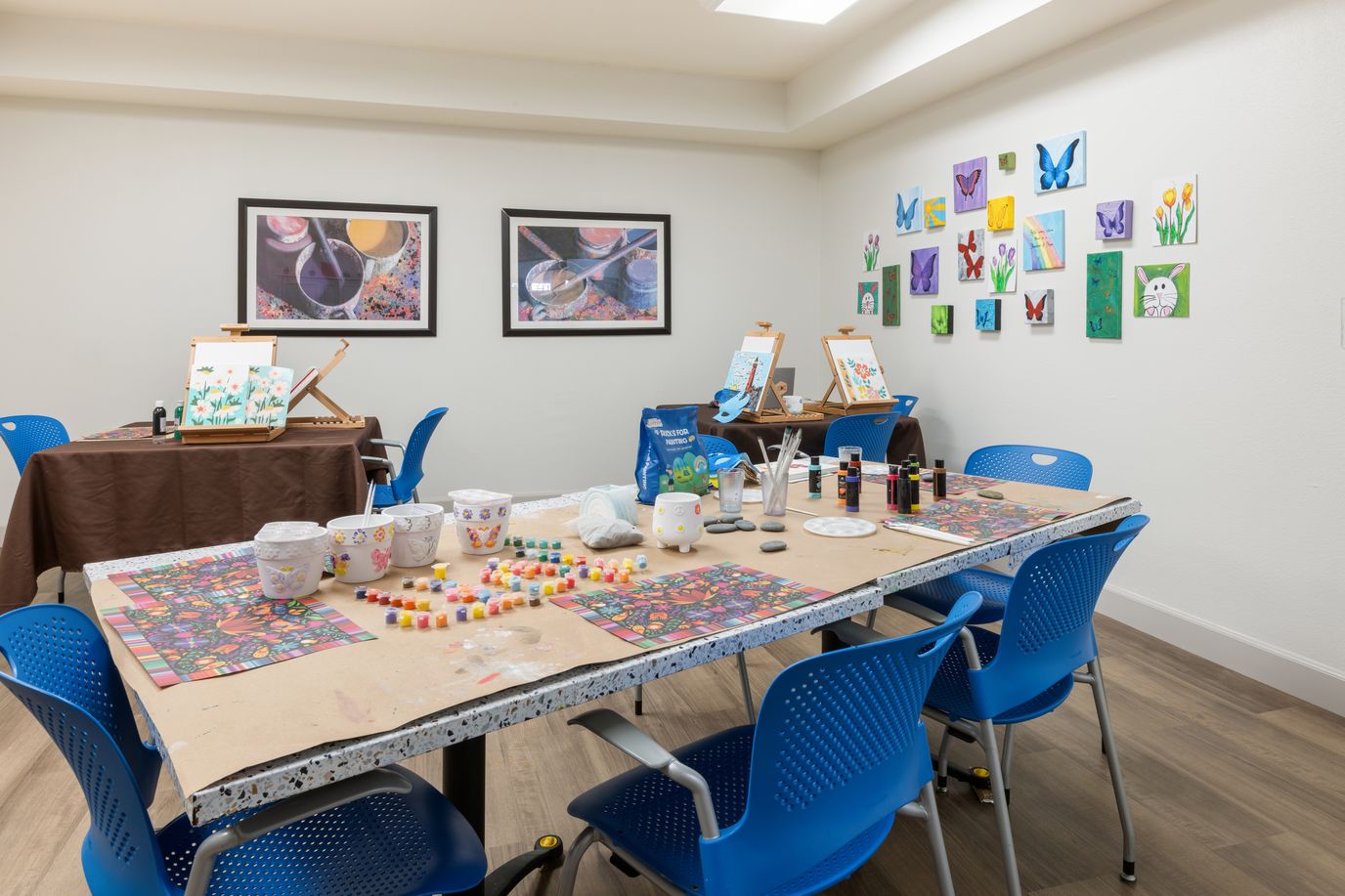 Art activity room with supplies and artwork displayed