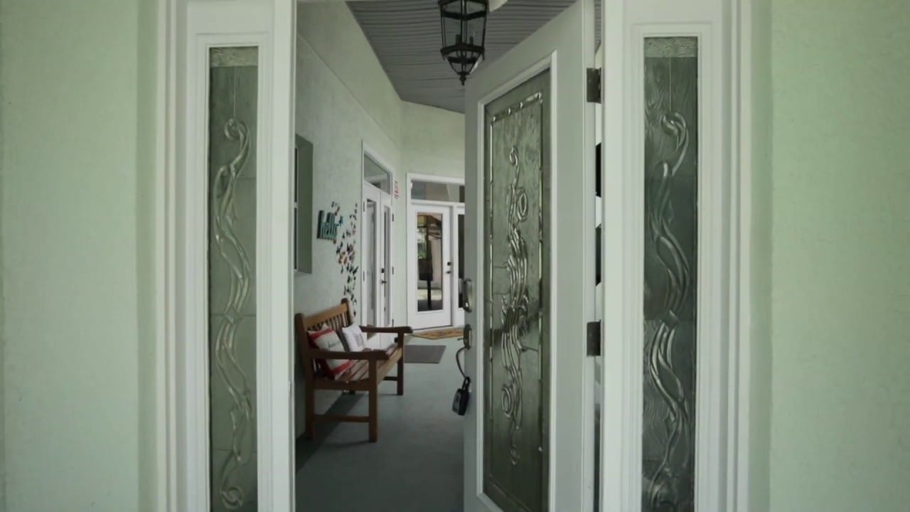 Open entrance to a hallway with seating area
