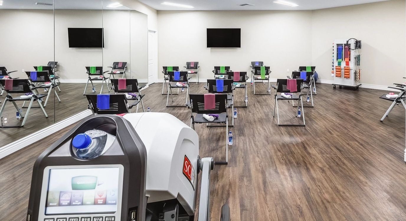 Interior fitness area with exercise equipment and seating