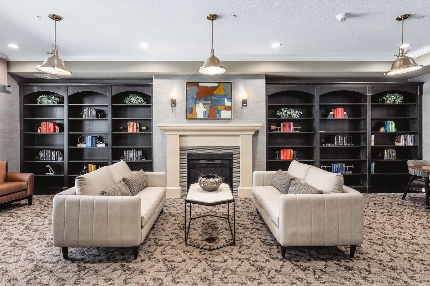 Cozy lounge area with bookshelves and seating