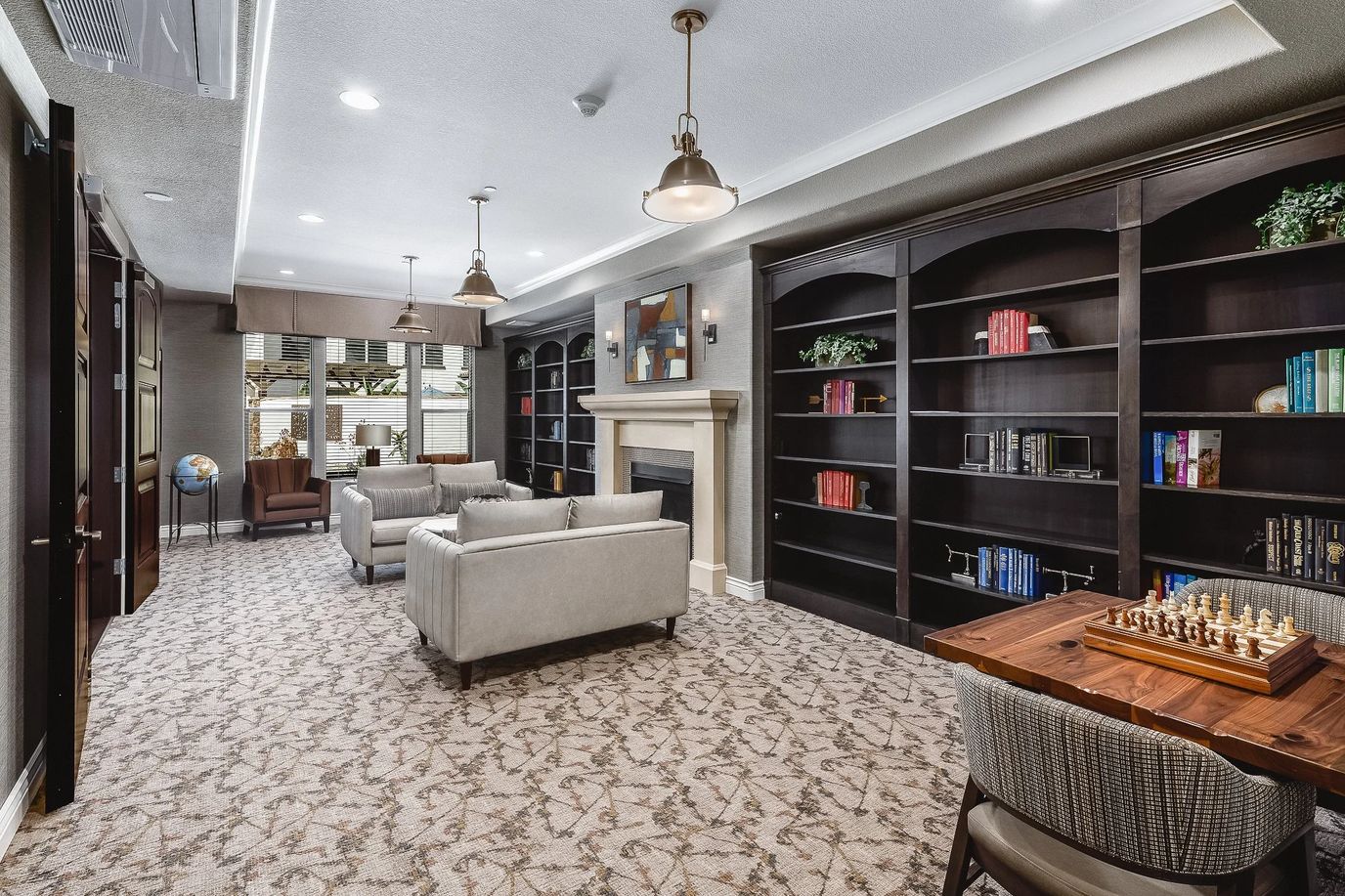 Interior common area with seating and bookshelves