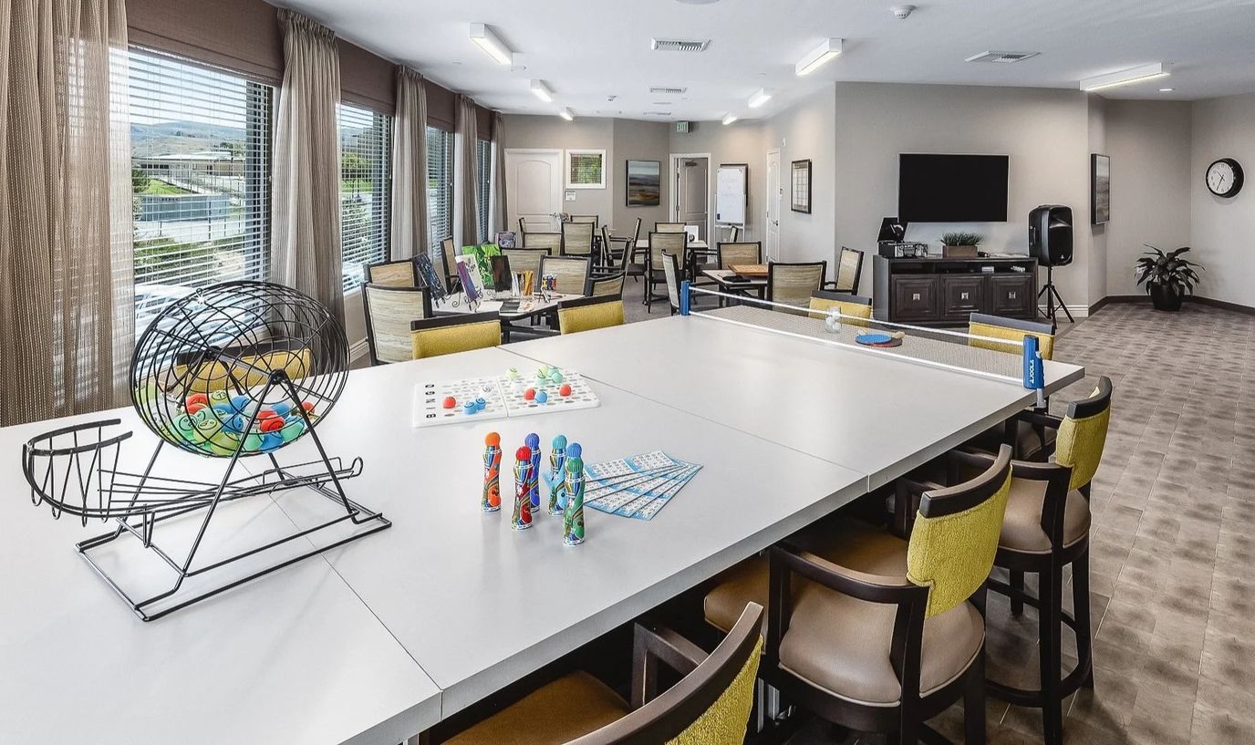 Bright activity room with bingo setup and seating