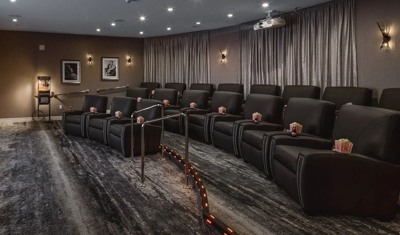 A cozy theater room with reclining seats