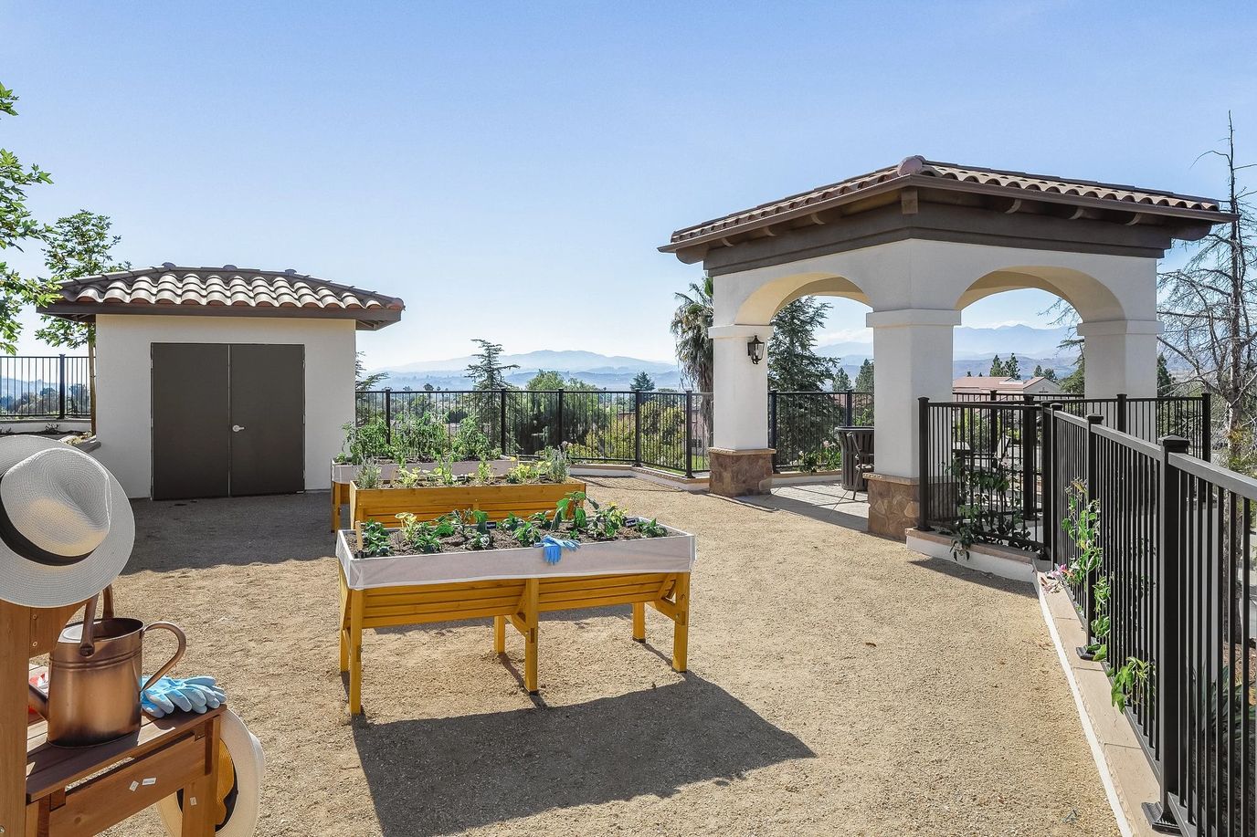 Outdoor garden area with raised planters and a gazebo