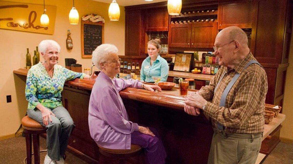 Residents chatting in a cozy interior lounge