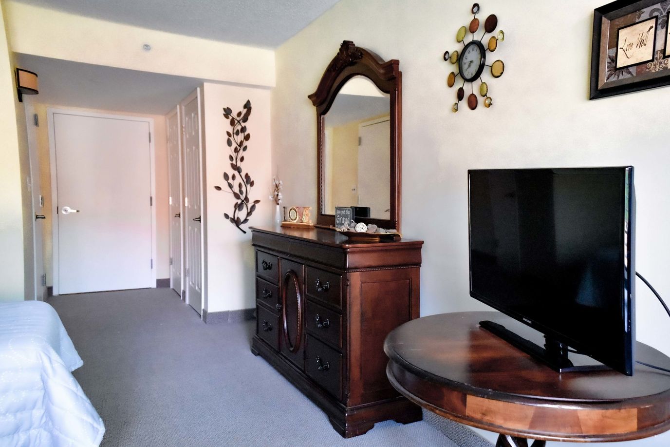 Brightly lit resident room with furniture and decor