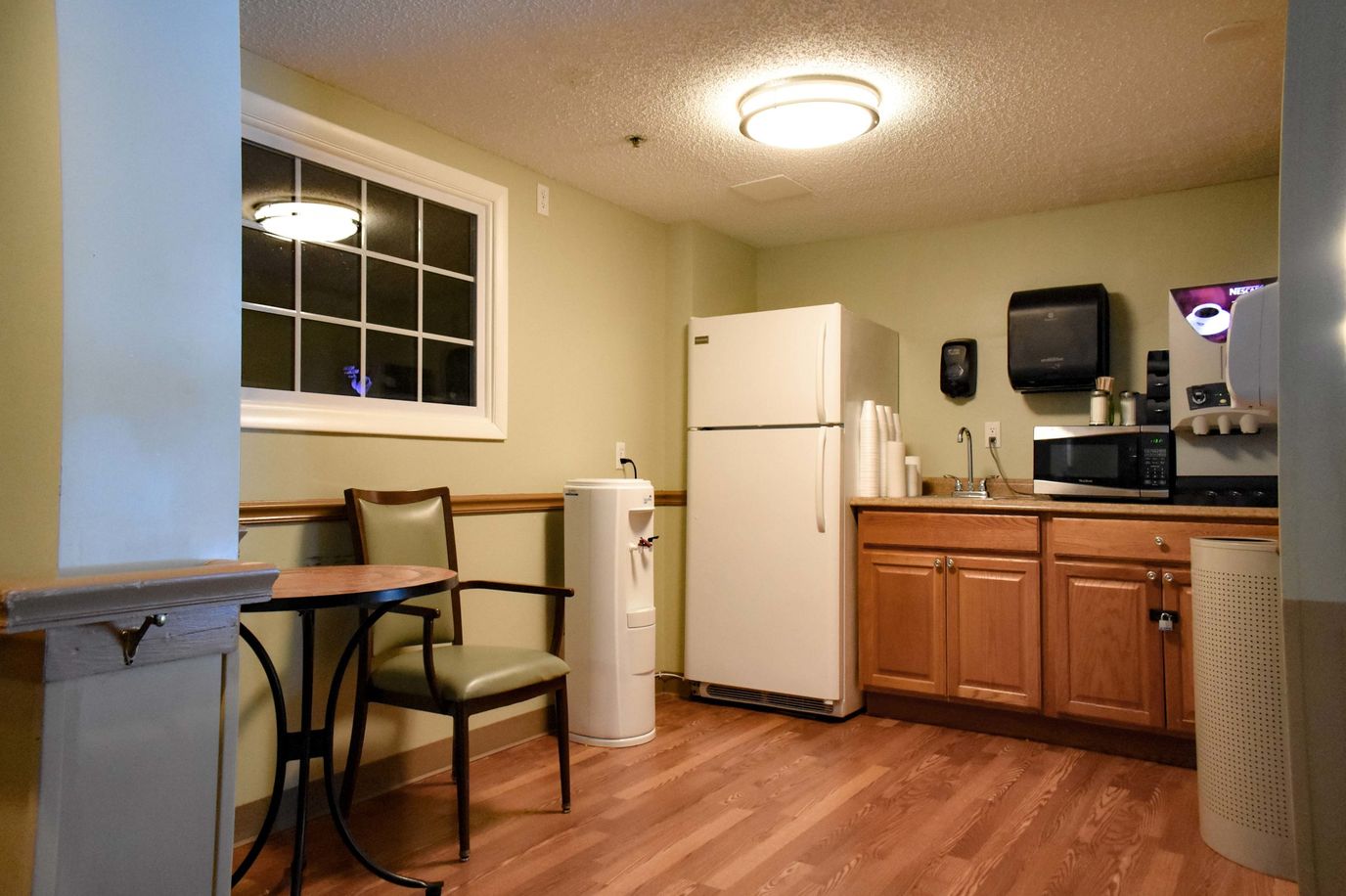 Cozy kitchenette area with appliances and seating