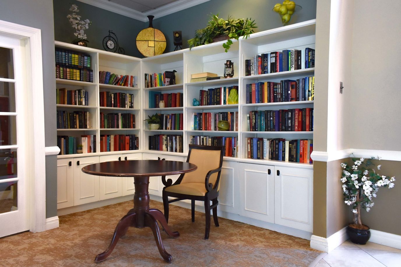Cozy reading nook with bookshelves and a table