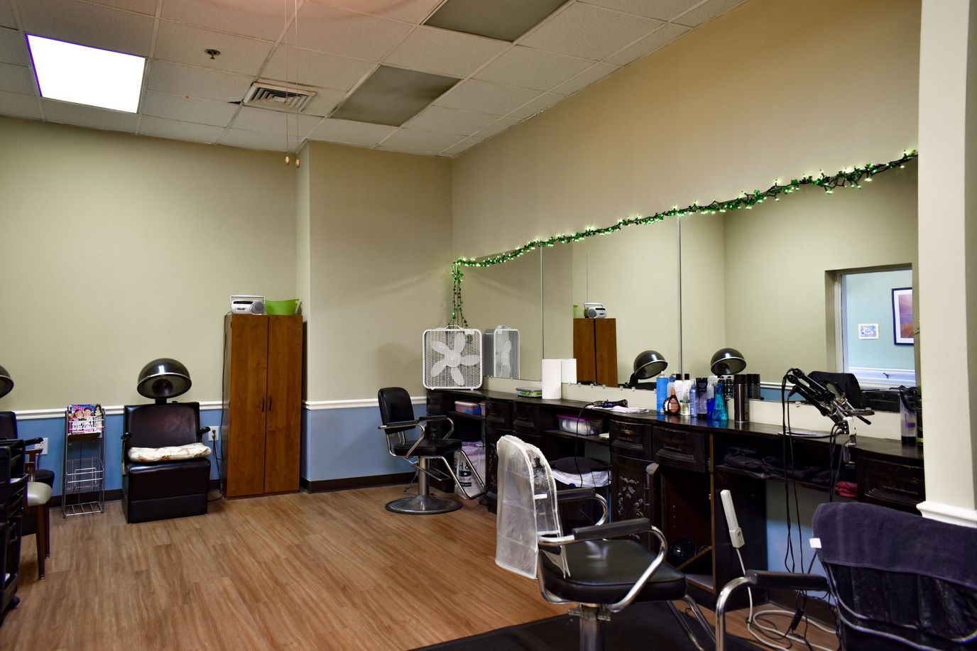 A well-lit hair salon interior with styling chairs and mirrors