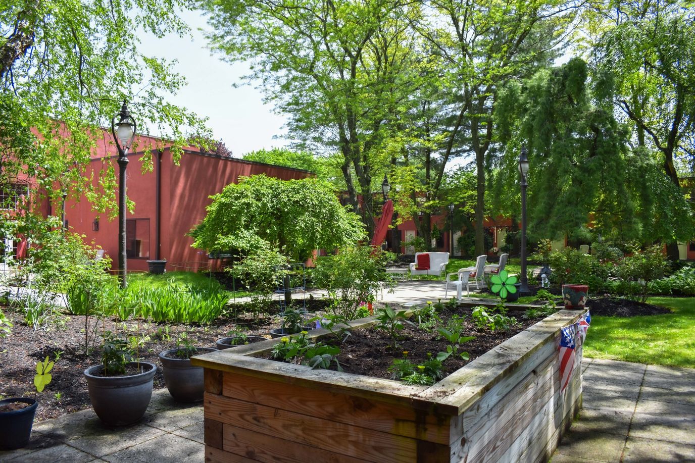 Outdoor garden area with greenery and seating