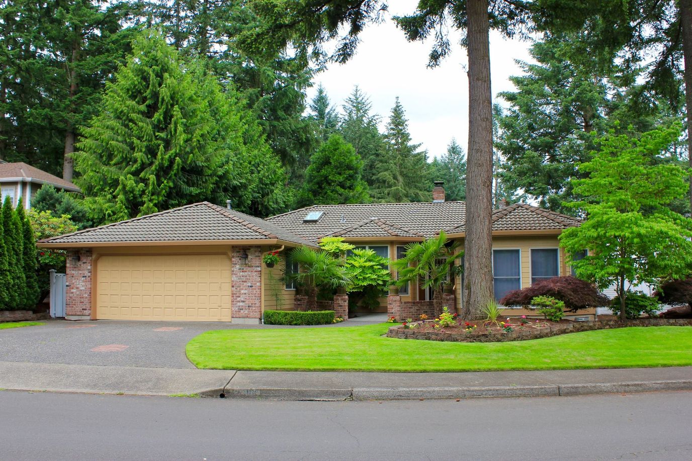 Exterior view of a single-story home with landscaping
