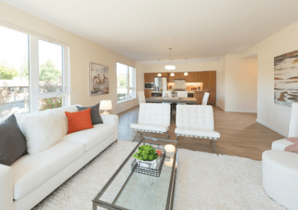 Bright common area with modern furniture and windows
