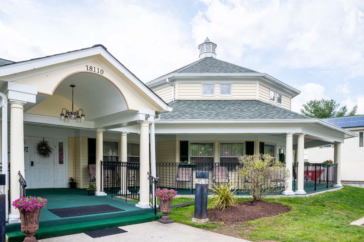 Exterior view of AlfredHouse V with porch and columns