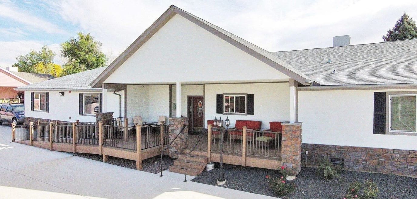 Exterior view of Arvada White House facility with porch