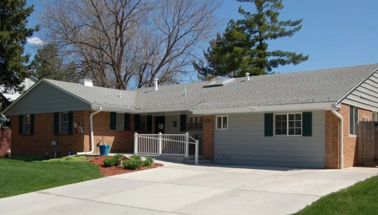 Exterior view of a senior living facility with a porch