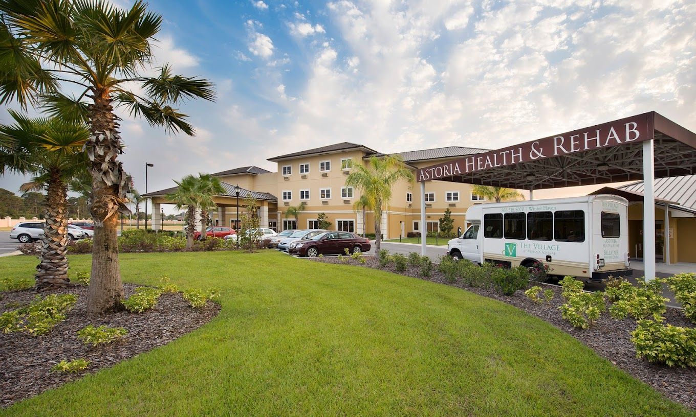Exterior view of Astoria Health & Rehab facility with vehicle