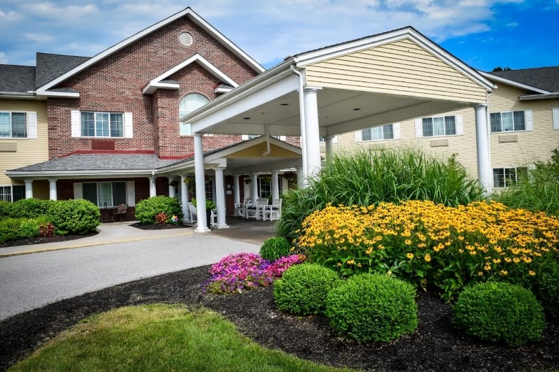Front entrance of Eden Vista Stow with vibrant landscaping