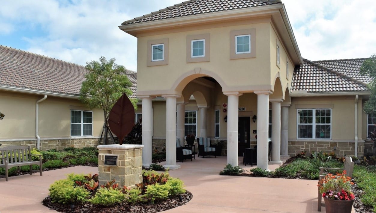 Entrance of Liana of North Sarasota with lush landscaping