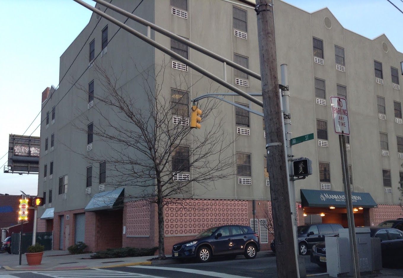 Exterior view of ManhattanView Center building at dusk