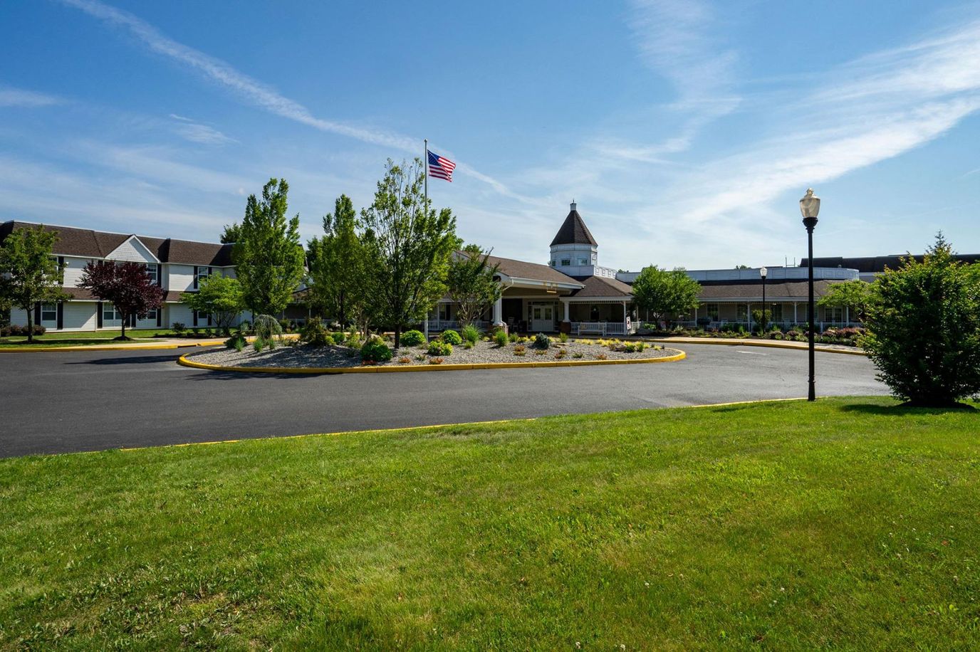 Exterior view of a senior living facility with landscaping