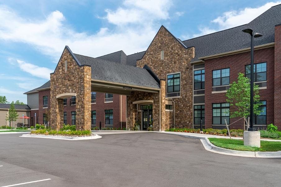 Exterior view of StoryPoint Macomb with entrance and landscaping