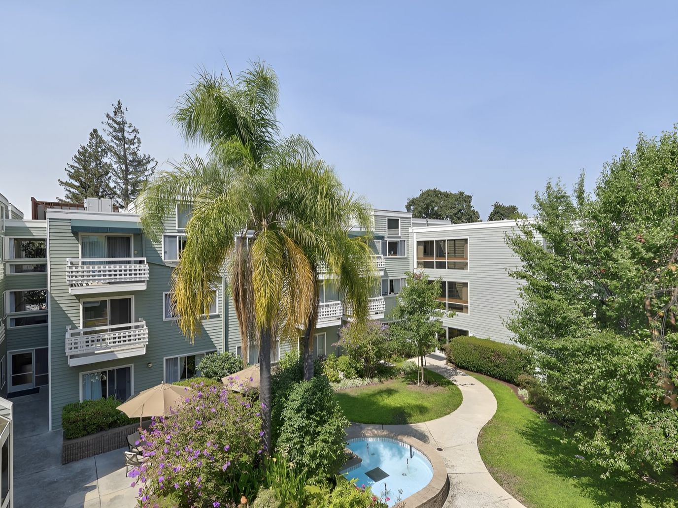 View of outdoor space with building and pool area
