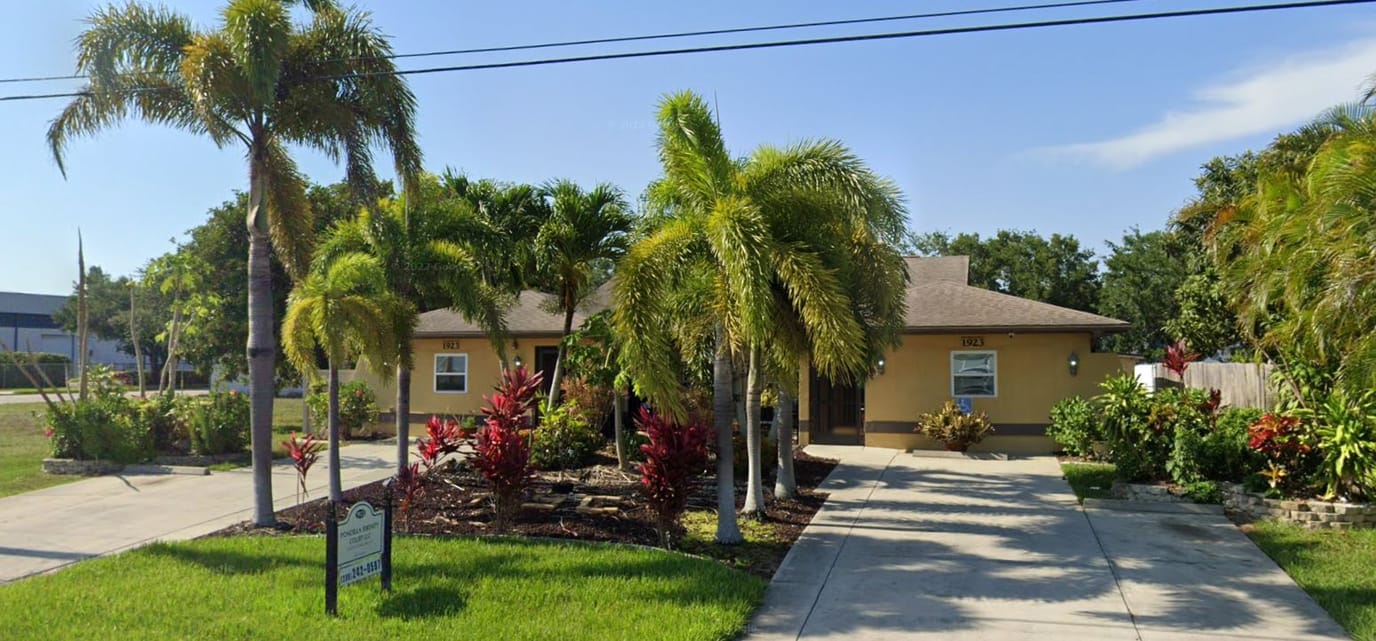 Exterior view of Pondella Residential Care with landscaped garden
