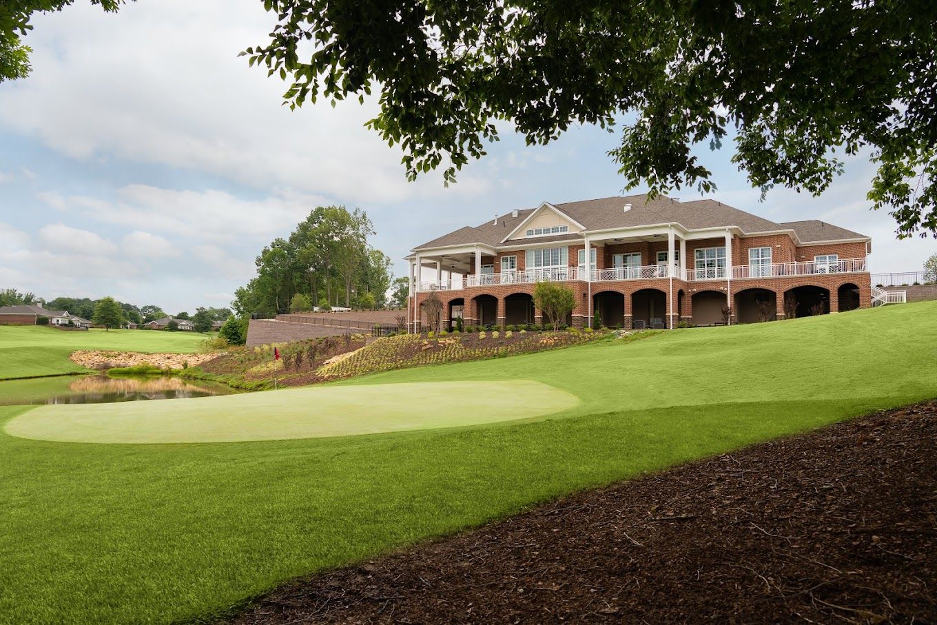 Exterior view of River Landing At Sandy Ridge with landscaping