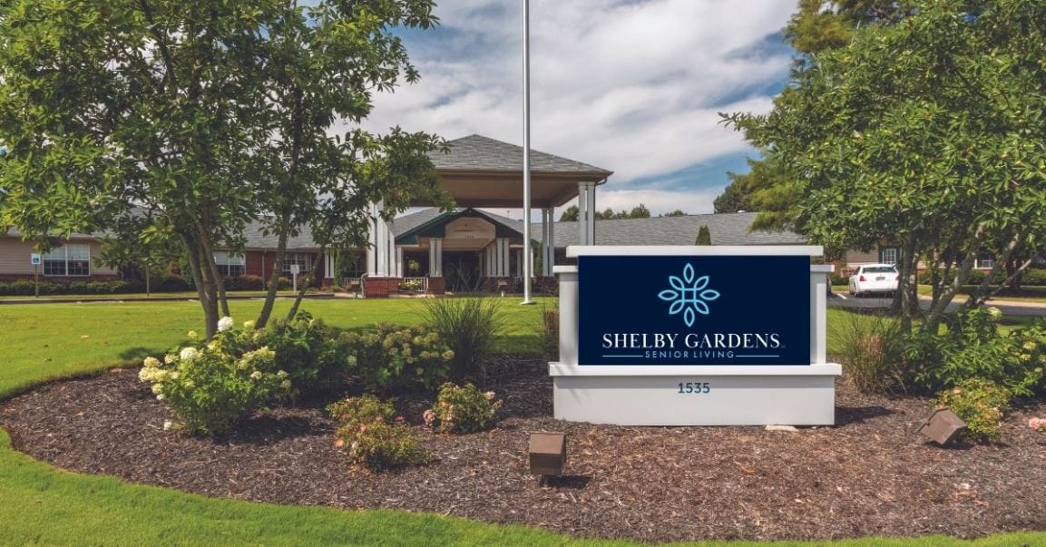 Exterior view of Shelby Gardens facility with sign