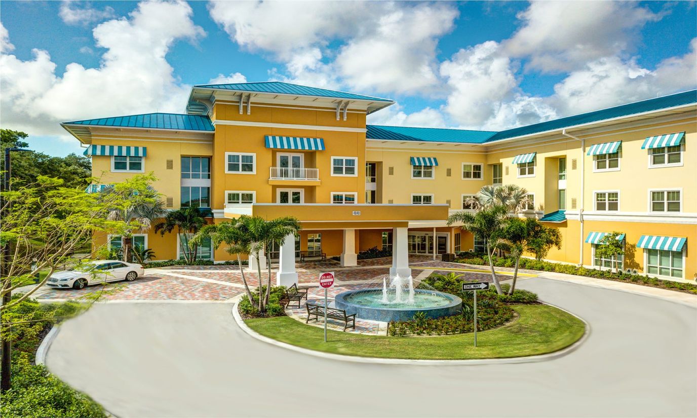 Exterior view of Symphony at Delray Beach with garden