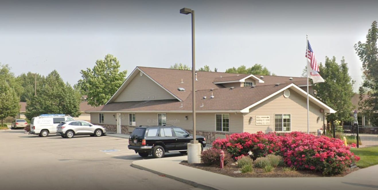 Exterior view of an assisted living facility with landscaping