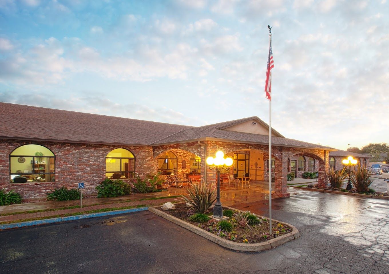 Exterior view of Westgate Gardens Care Center at sunset
