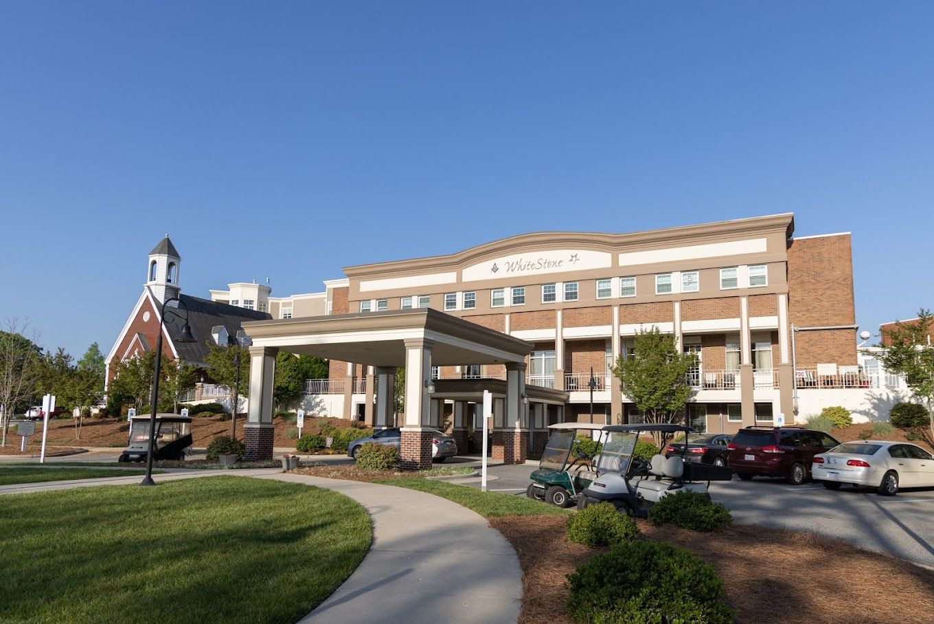 Exterior view of the WhiteStone facility with landscaping