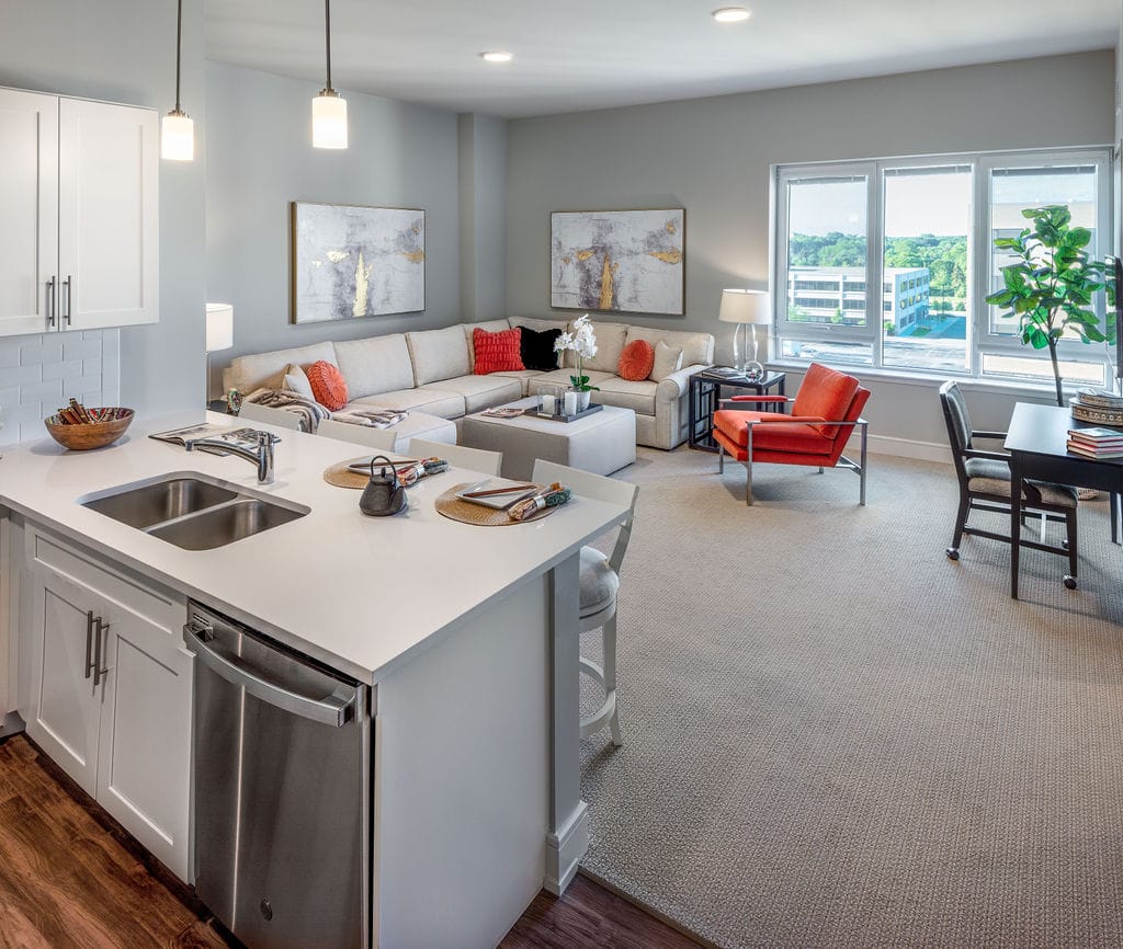 Garden Estates of Temple, assisted living in Temple, TX — Modern living room with kitchen and seating area