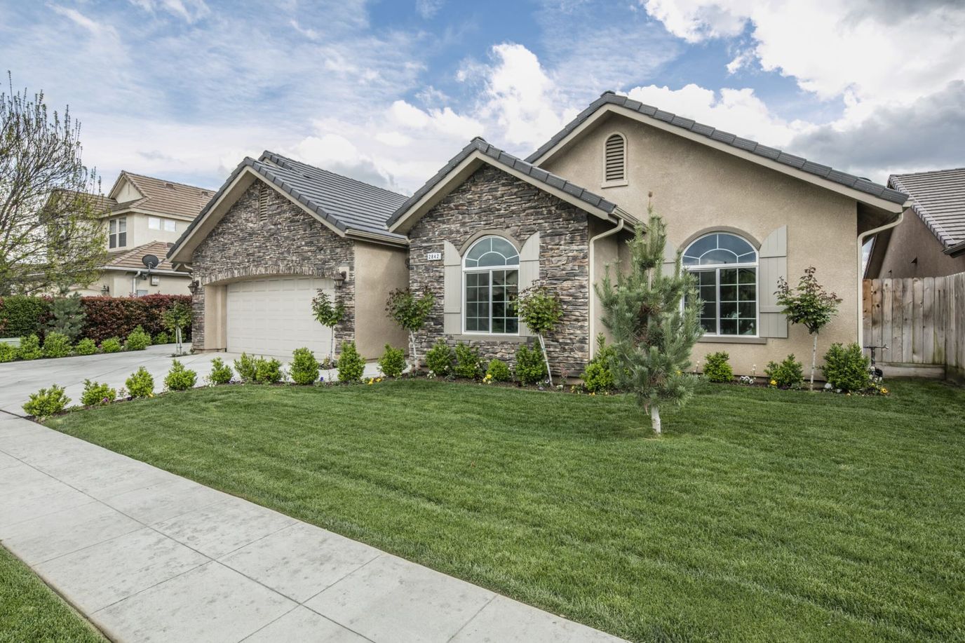 Exterior view of a residential building with landscaping