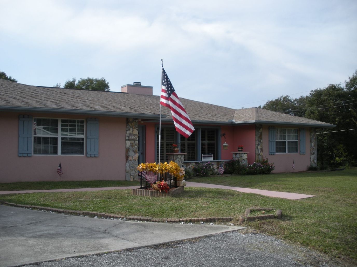 Exterior view of a nursing home with an American flag