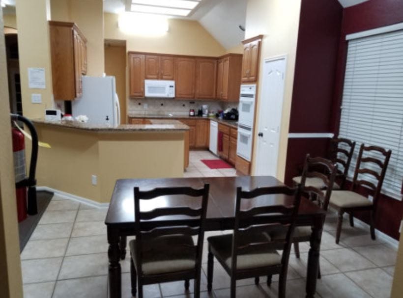 Bright kitchen area with dining table and chairs
